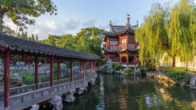 A pavilion, covered walkway and pond inside Yu Garden in Shanghai