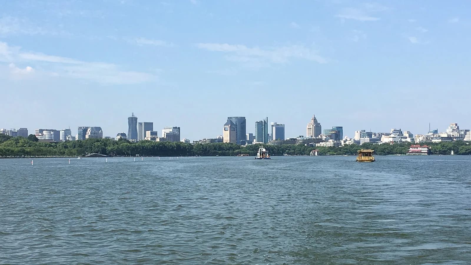 Hangzhou’s West Lake with the city skyline beyond the water